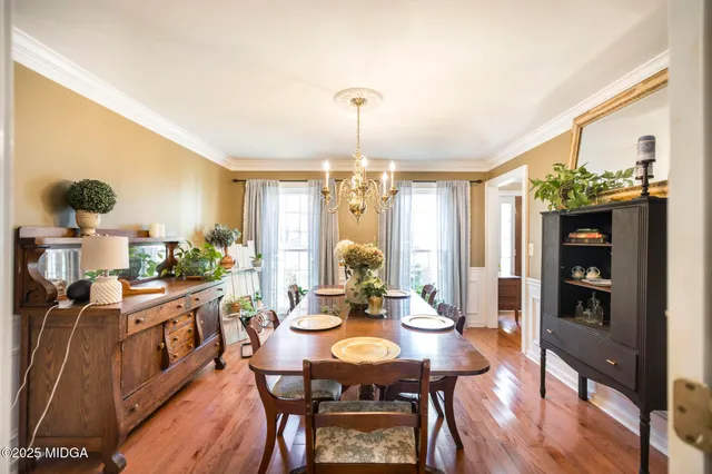 a living room with furniture and a bookshelf