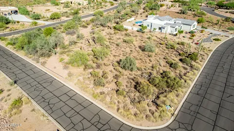 an aerial view of residential houses and outdoor space