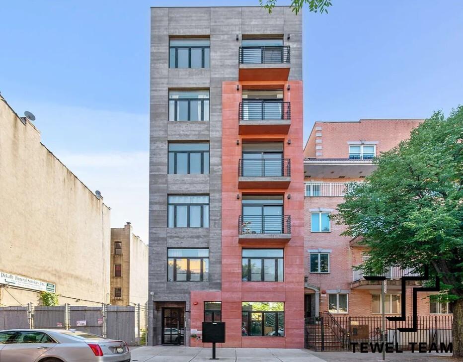 a front view of a building with glass windows