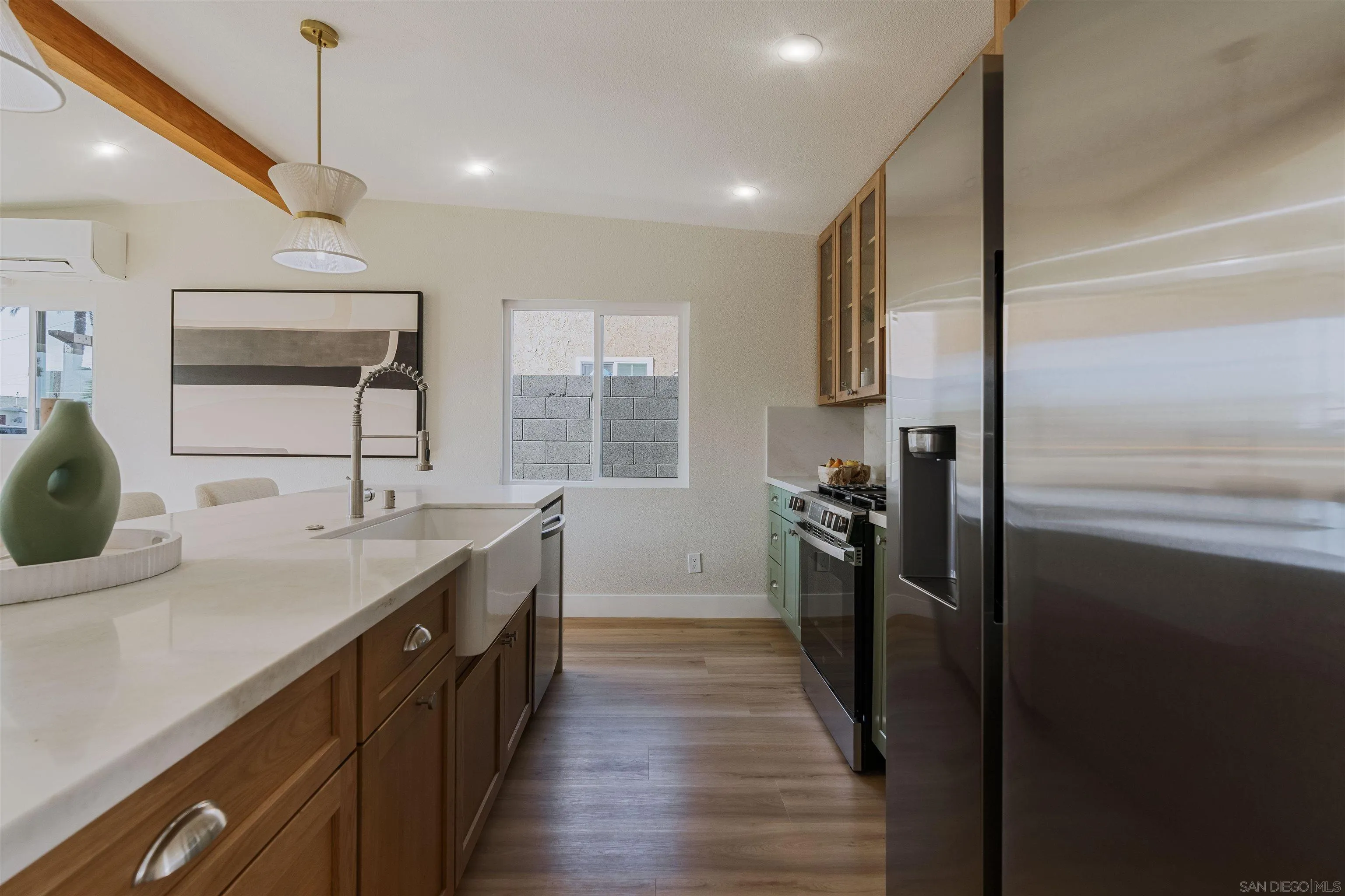 1426 Santa Rosa Street Oceanside, CA 92058 - Photo 21 of 73 a kitchen with a sink stove and refrigerator