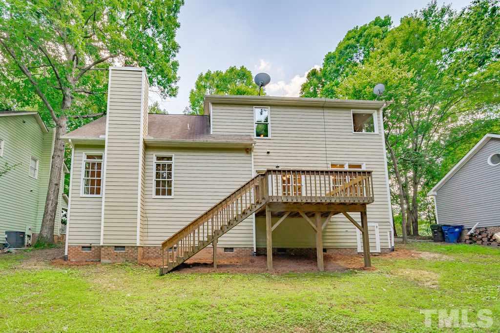 3433 Singleleaf Lane Raleigh, NC 27616 - Photo 2 of 28 a view of a chair and table in backyard of the house