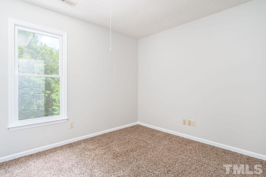 3433 Singleleaf Lane Raleigh, NC 27616 - Photo 23 of 28 an empty room with a window