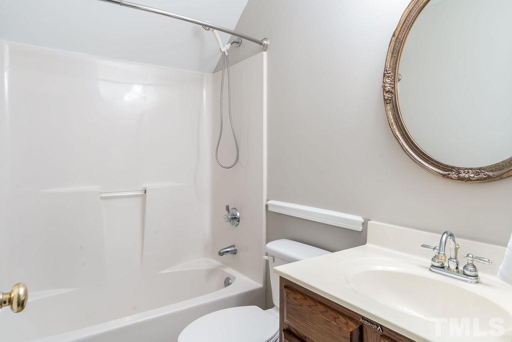 3433 Singleleaf Lane Raleigh, NC 27616 - Photo 26 of 28 a bathroom with a sink and a mirror