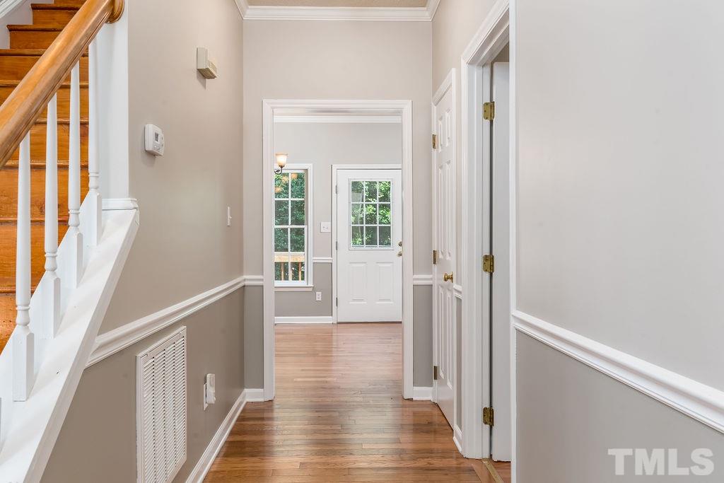 3433 Singleleaf Lane Raleigh, NC 27616 - Photo 5 of 28 a view of a hallway with wooden floor and staircase