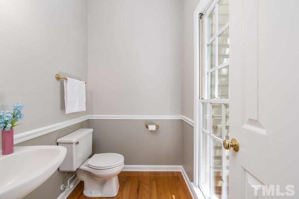 3433 Singleleaf Lane Raleigh, NC 27616 - Photo 7 of 28 a bathroom with a toilet and a shower