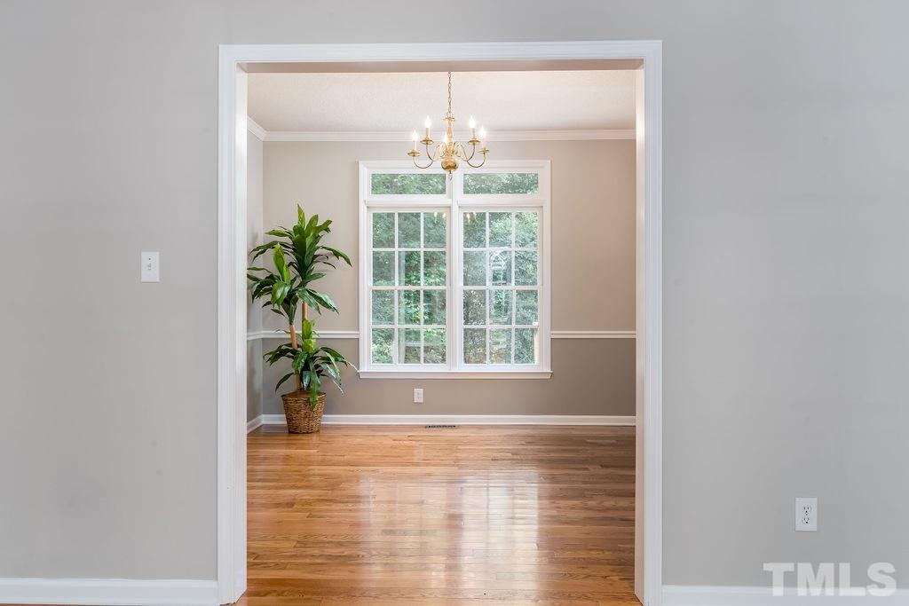 3433 Singleleaf Lane Raleigh, NC 27616 - Photo 9 of 28 a view of an empty room with potted plants and a shower