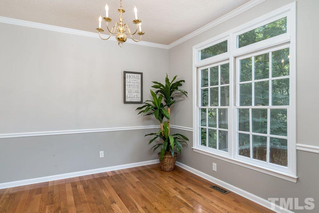 3433 Singleleaf Lane Raleigh, NC 27616 - Photo 10 of 28 a view of a door with a potted plant
