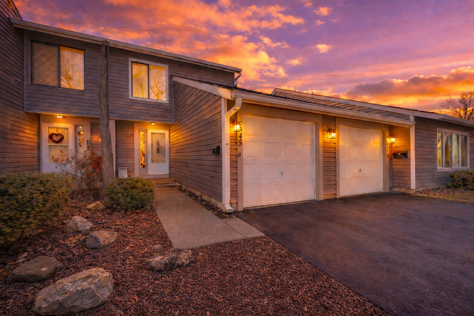 a view of a house with backyard and porch