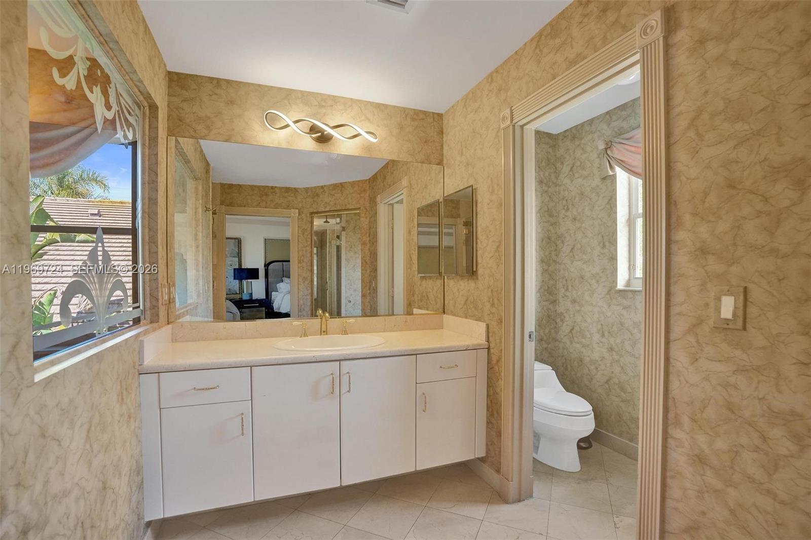 17431 Southwest 35th Street Miramar, FL 33029 - Photo 12 of 61 a spacious bathroom with a double vanity sink toilet and shower
