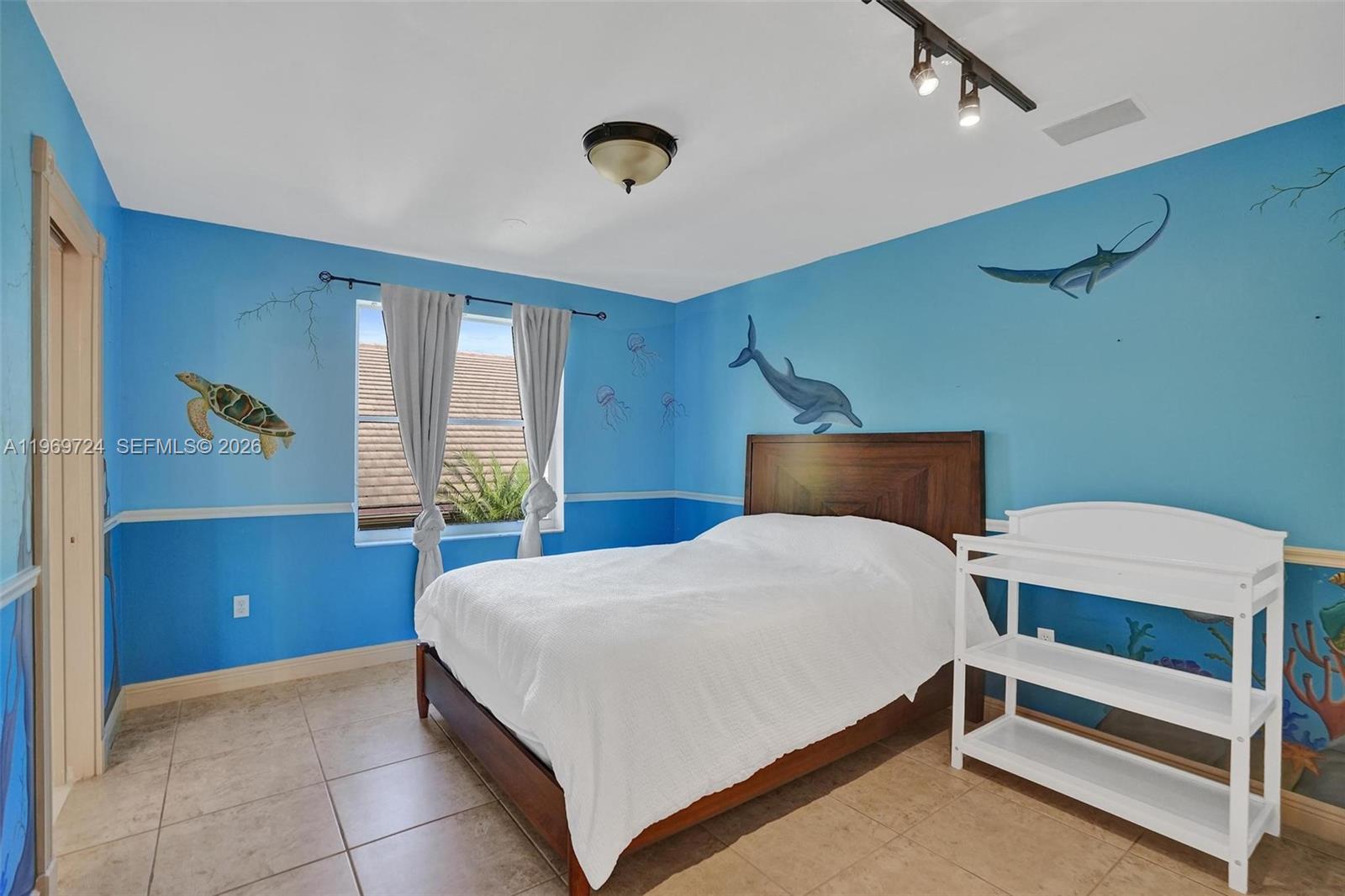 17431 Southwest 35th Street Miramar, FL 33029 - Photo 21 of 61 a bedroom with a bed and a dresser