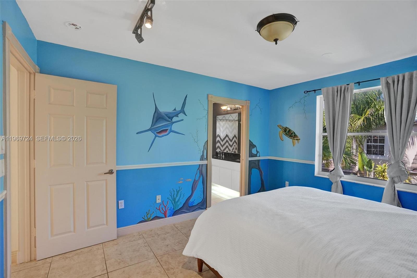 17431 Southwest 35th Street Miramar, FL 33029 - Photo 22 of 61 a bedroom with a bed and a dresser