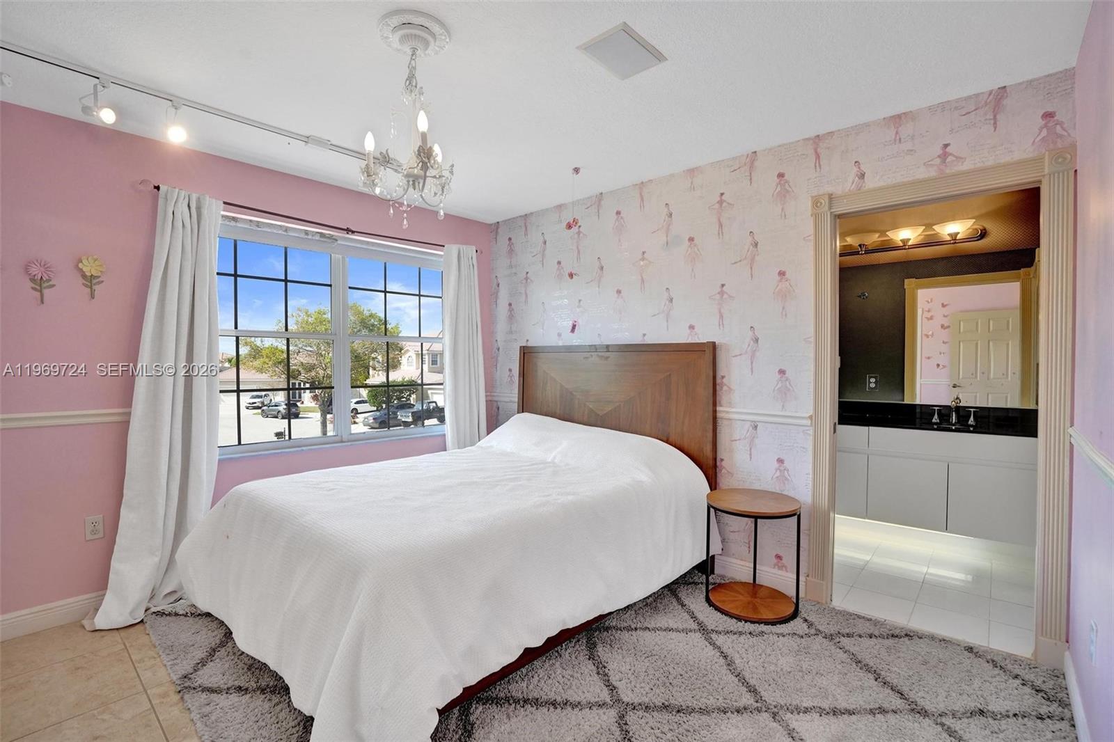 17431 Southwest 35th Street Miramar, FL 33029 - Photo 25 of 61 a bedroom with a bed and a mirror