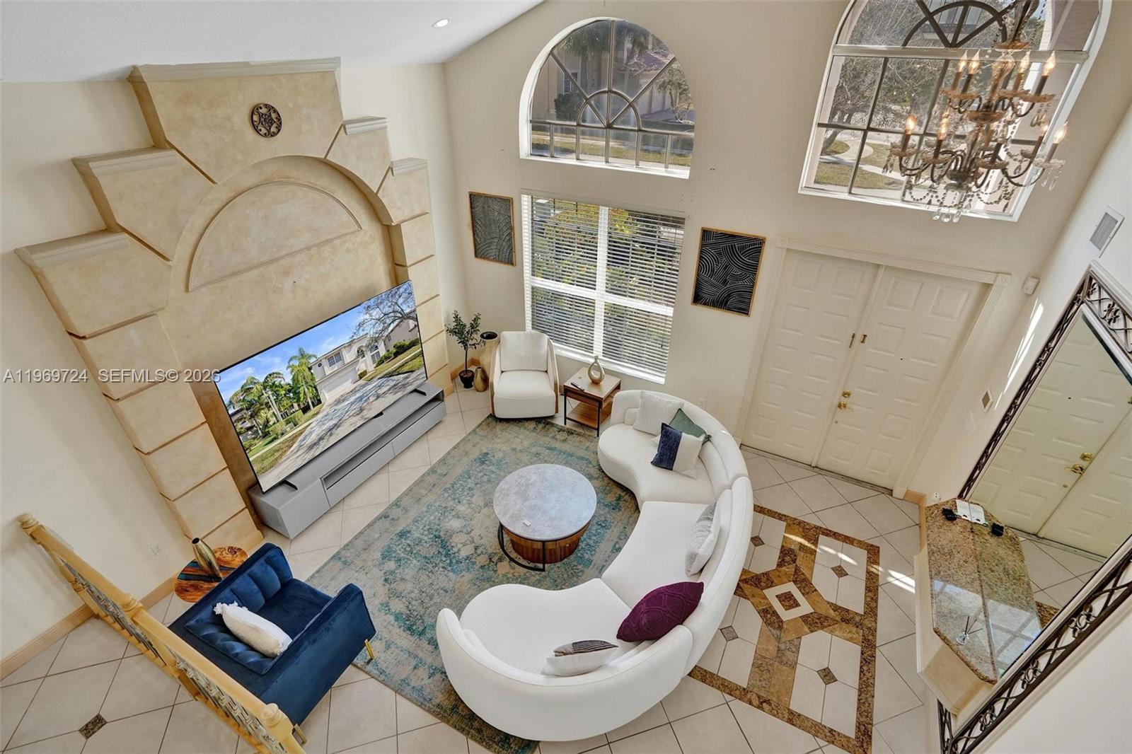 17431 Southwest 35th Street Miramar, FL 33029 - Photo 28 of 61 a living room with furniture and a mirror