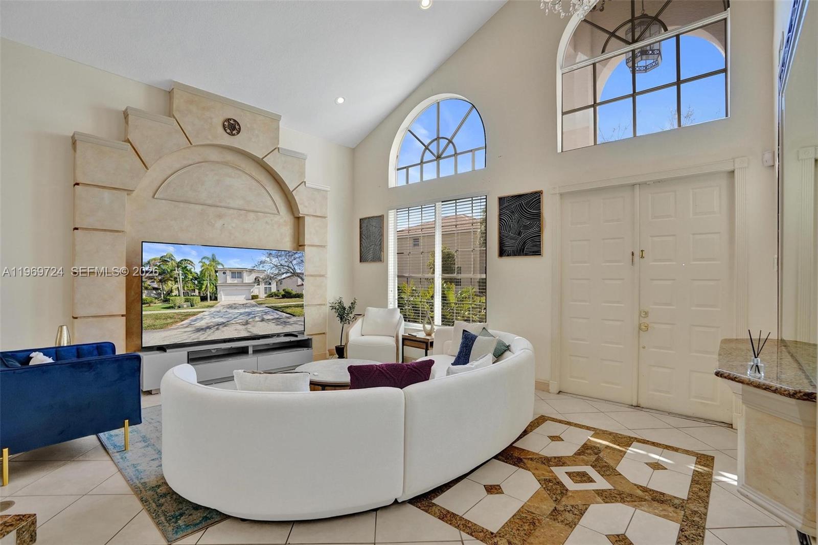 17431 Southwest 35th Street Miramar, FL 33029 - Photo 30 of 61 a living room with furniture and a flat screen tv