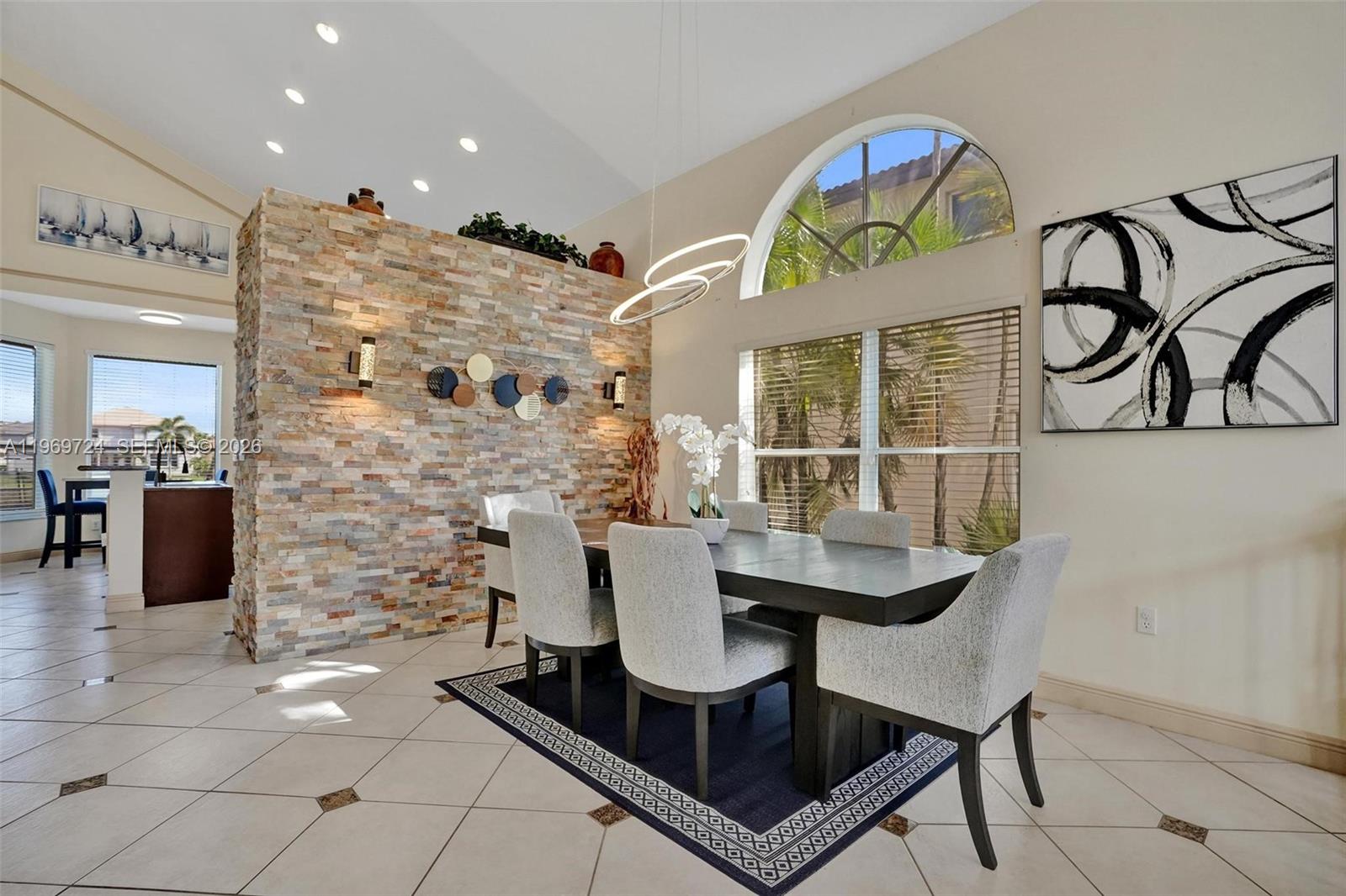 17431 Southwest 35th Street Miramar, FL 33029 - Photo 33 of 61 a dining room with furniture and a chandelier