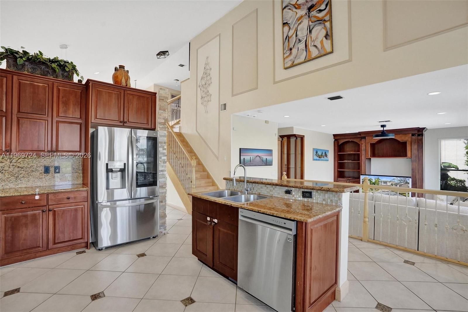 17431 Southwest 35th Street Miramar, FL 33029 - Photo 40 of 61 a kitchen with stainless steel appliances granite countertop a refrigerator stove and sink