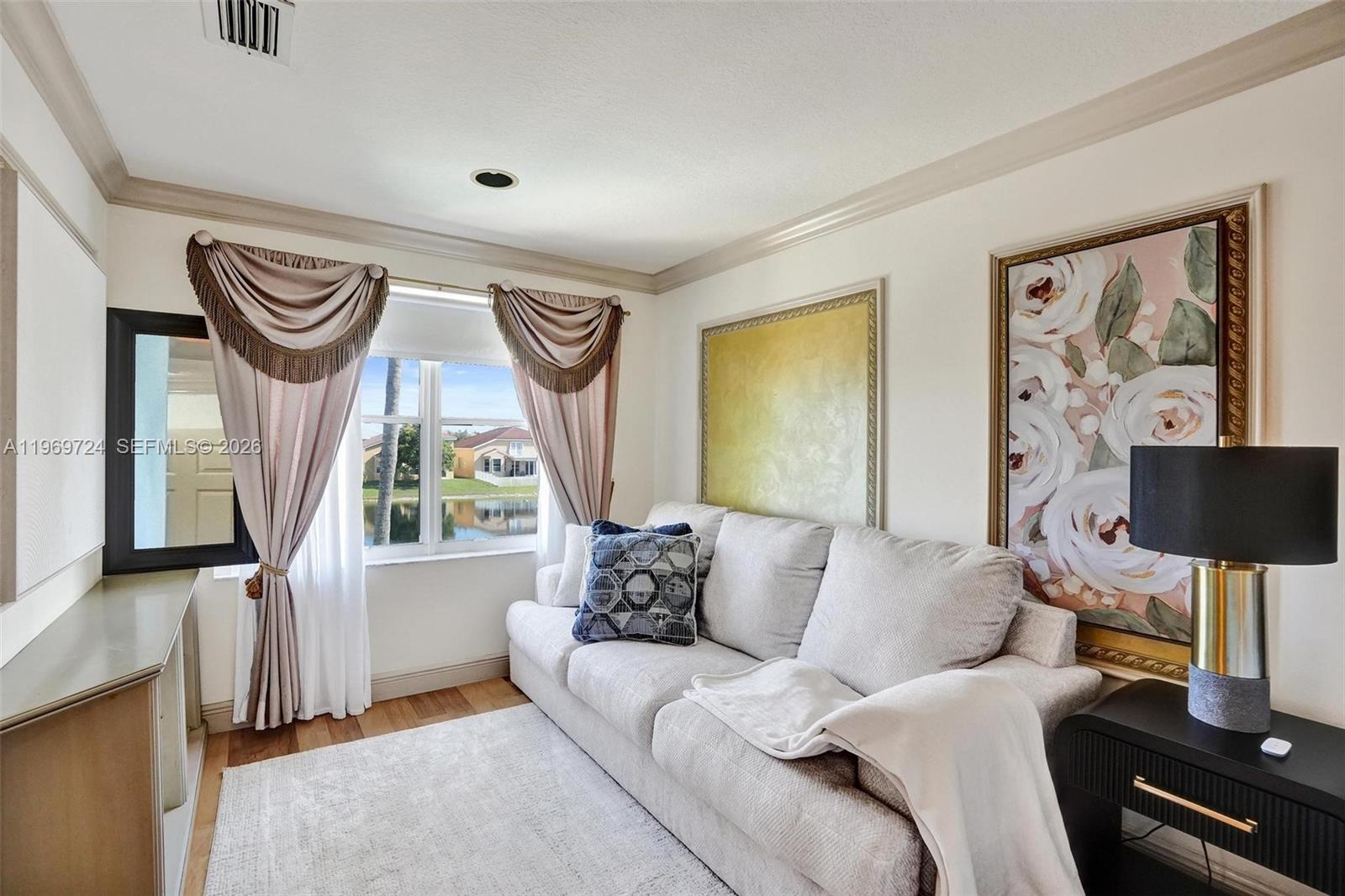 17431 Southwest 35th Street Miramar, FL 33029 - Photo 4 of 61 a living room with furniture and a window