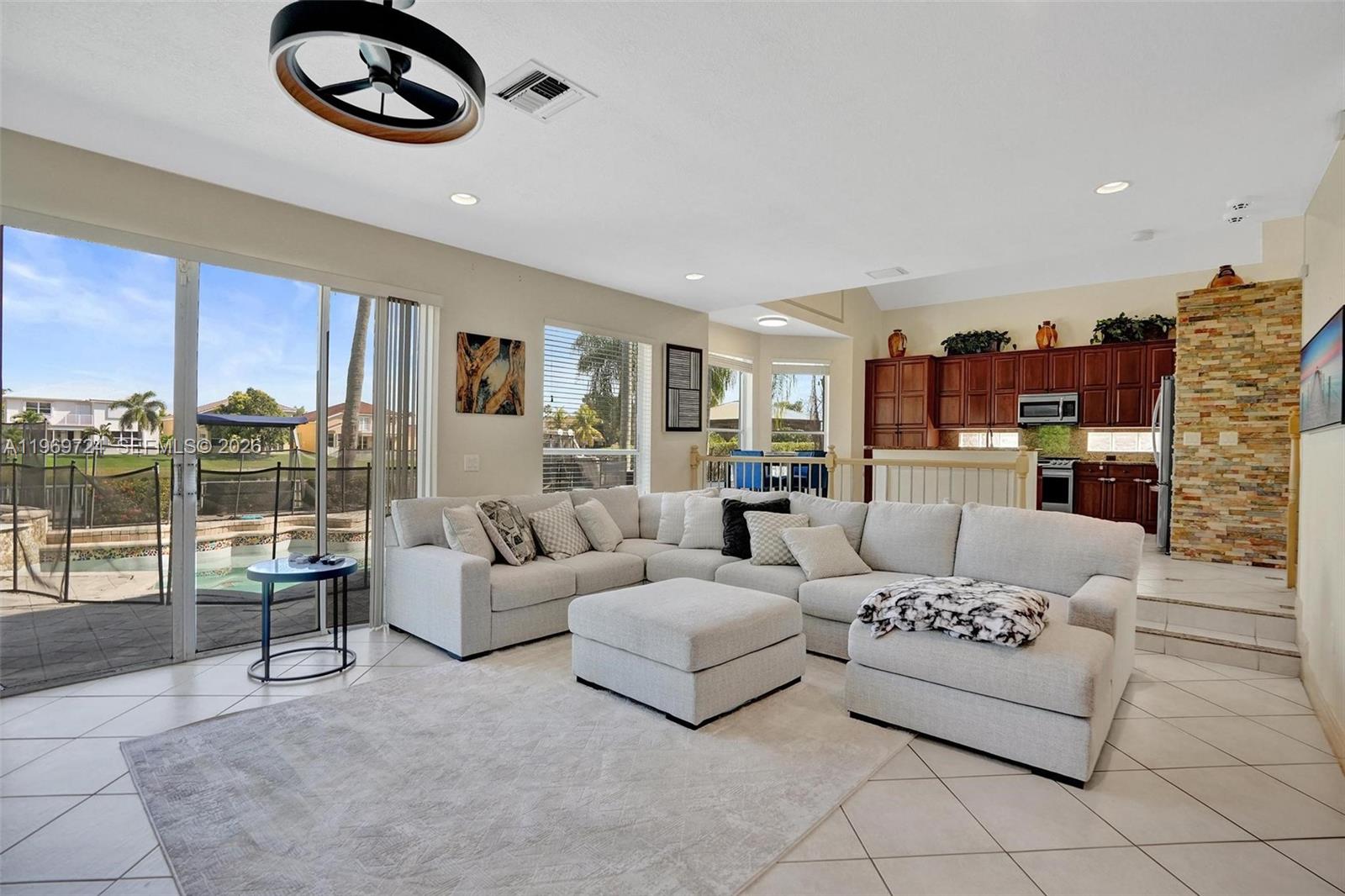 17431 Southwest 35th Street Miramar, FL 33029 - Photo 43 of 61 a living room with furniture and a large window
