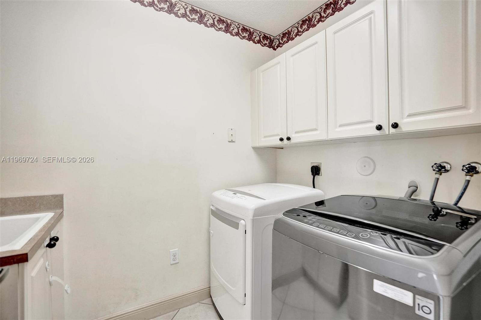 17431 Southwest 35th Street Miramar, FL 33029 - Photo 45 of 61 a utility room with dryer and washer