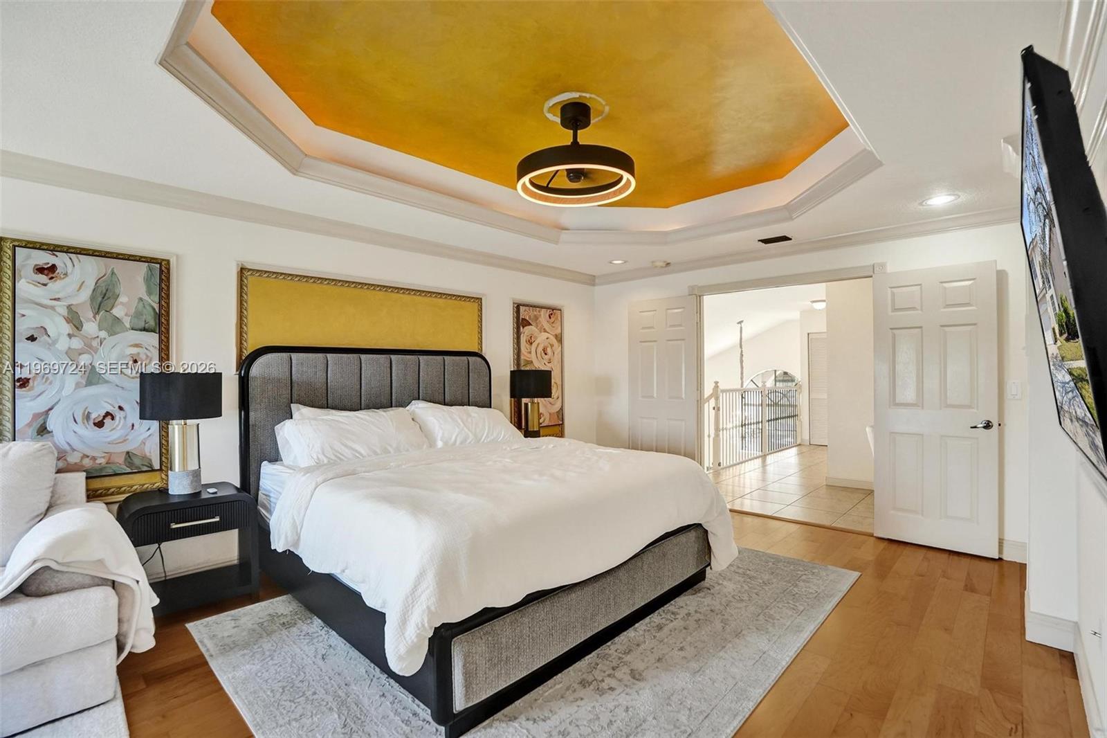 17431 Southwest 35th Street Miramar, FL 33029 - Photo 5 of 61 a bedroom with a bed and painting on the wall