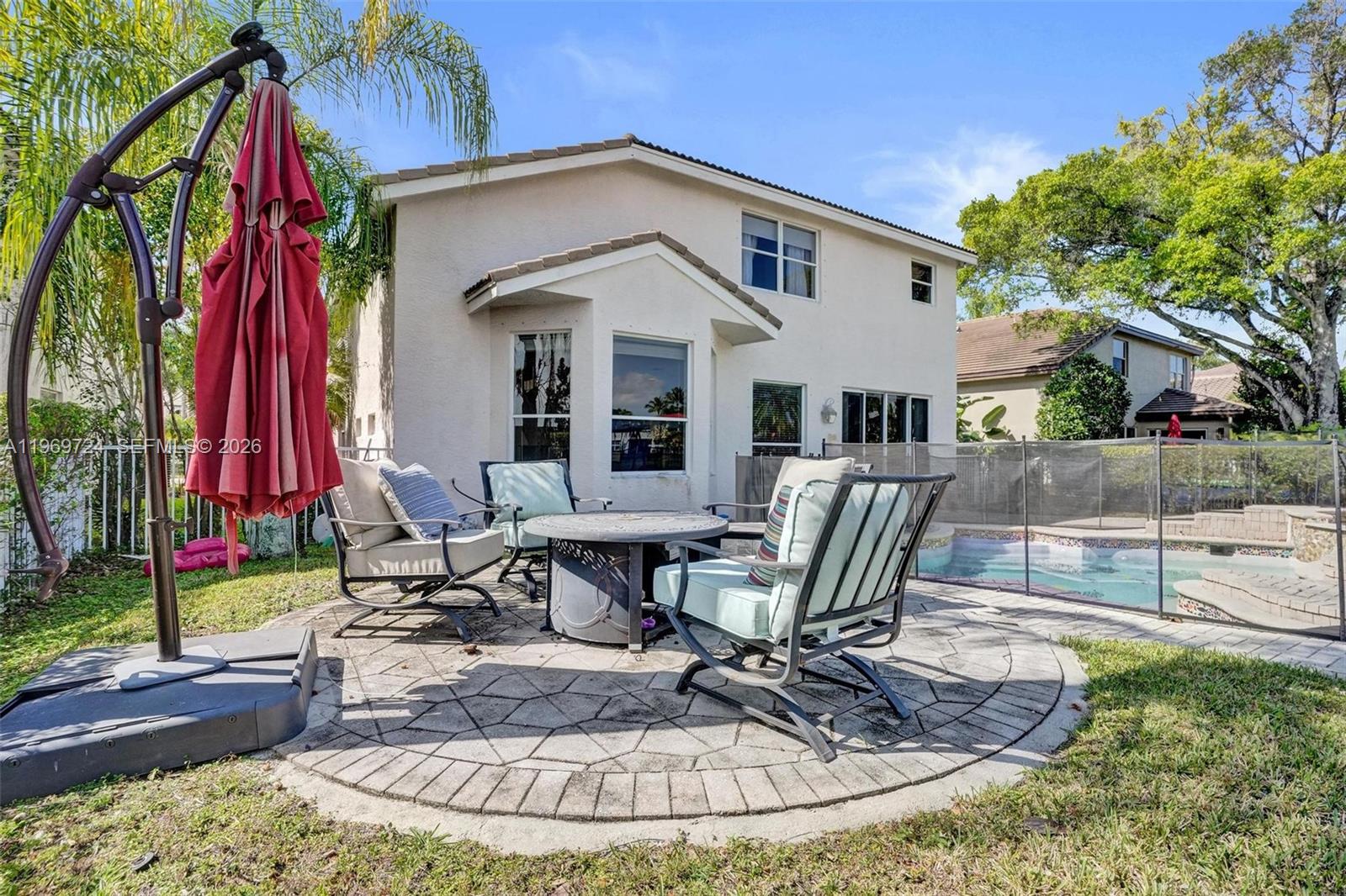 17431 Southwest 35th Street Miramar, FL 33029 - Photo 51 of 61 a view of a house with backyard water fountain and sitting area