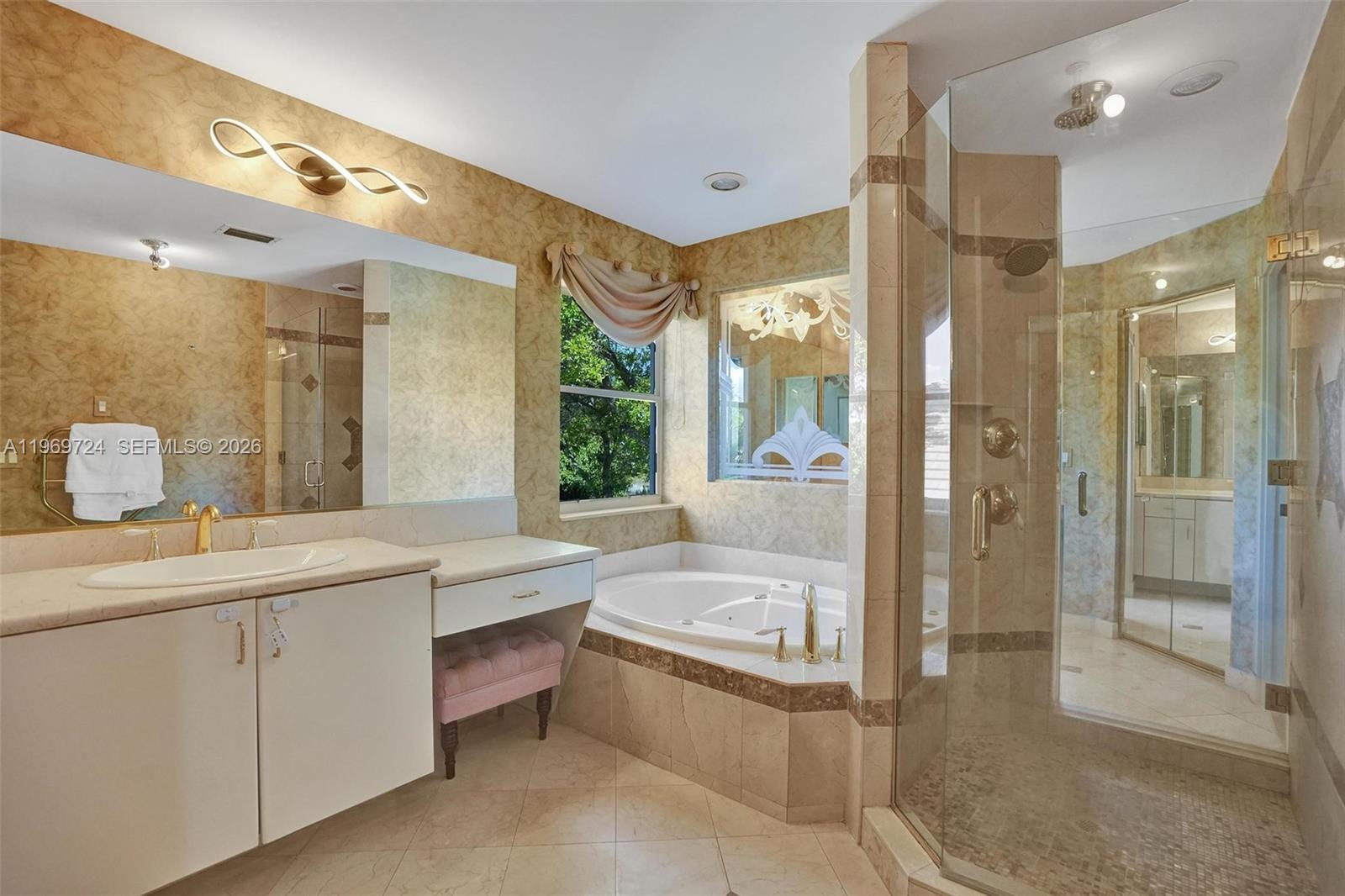 17431 Southwest 35th Street Miramar, FL 33029 - Photo 8 of 61 a bathroom with a tub sink shower and mirror