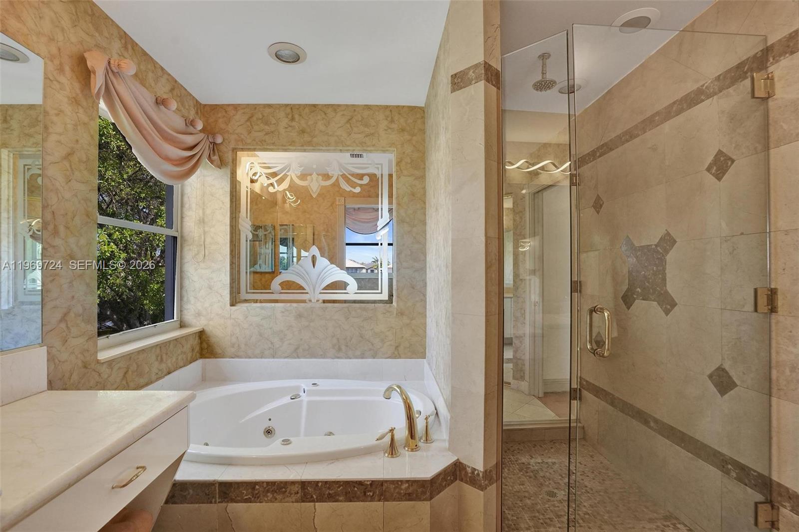 17431 Southwest 35th Street Miramar, FL 33029 - Photo 9 of 61 a bathroom with a bathtub and a shower