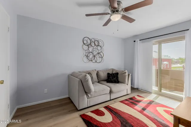 a living room with furniture and a rug