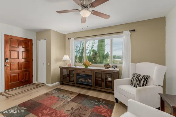 a living room with furniture and a large window