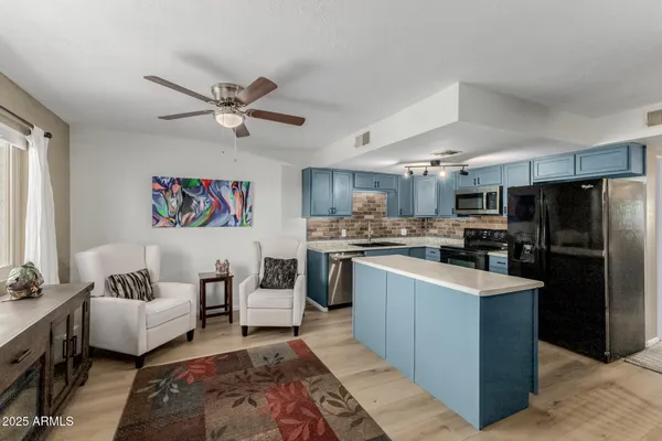 a kitchen with refrigerator cabinets and furniture