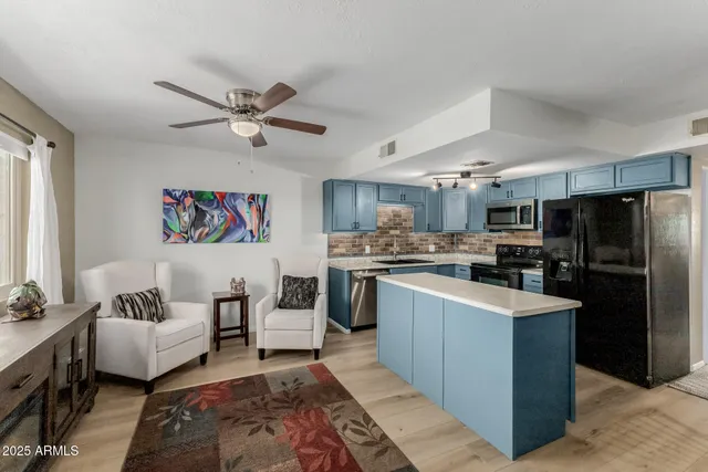 a kitchen with refrigerator cabinets and furniture