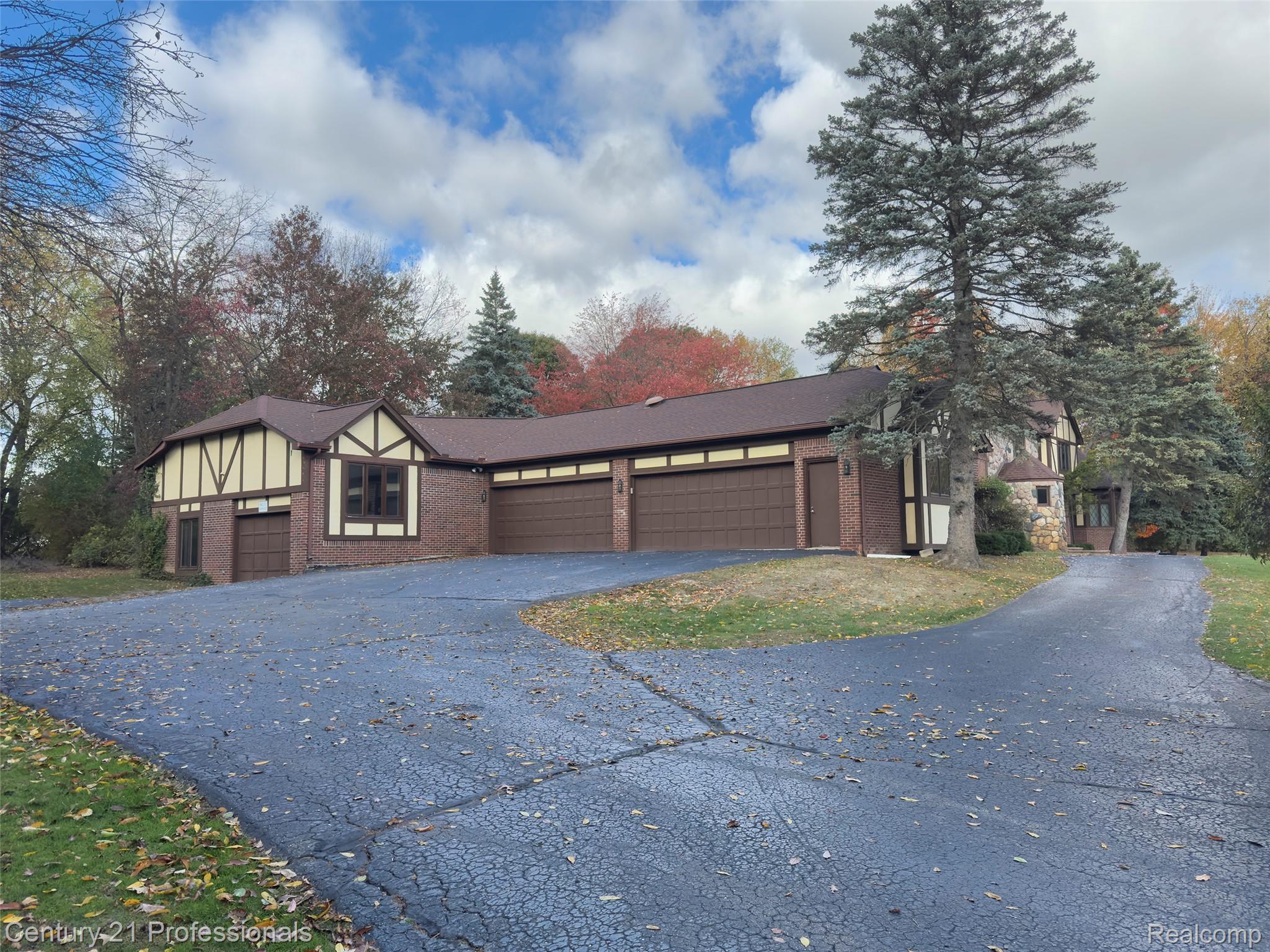 303 East Snell Road Rochester, MI 48306 - Photo 2 of 45 4 car and additional heated large back garage/workshop