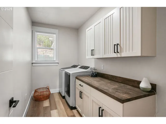 a bathroom with a granite countertop sink toilet a mirror and shower