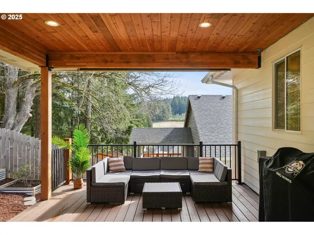 a view of a patio with table and chairs and potted plants