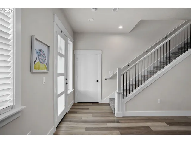 a view of entryway with wooden floor