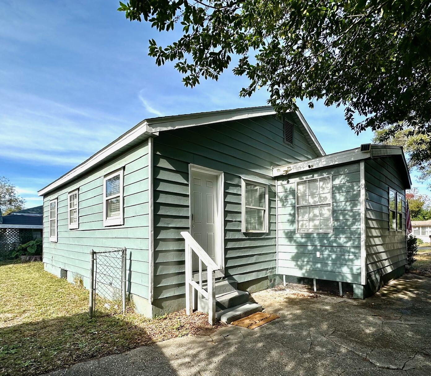 115 Milton Road Pensacola, FL 32507 - Photo 3 of 18 a view of a house with a yard