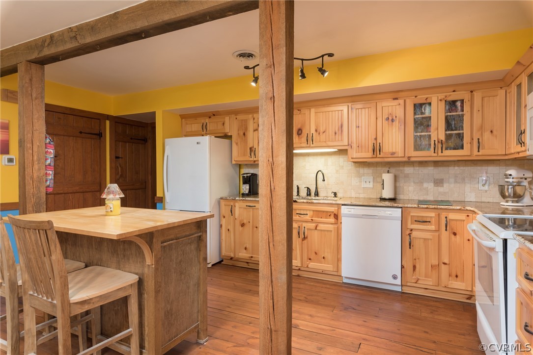 1400 Stone River Road North Chesterfield, VA 23235 - Photo 14 of 34 a kitchen with a sink cabinets and wooden floor