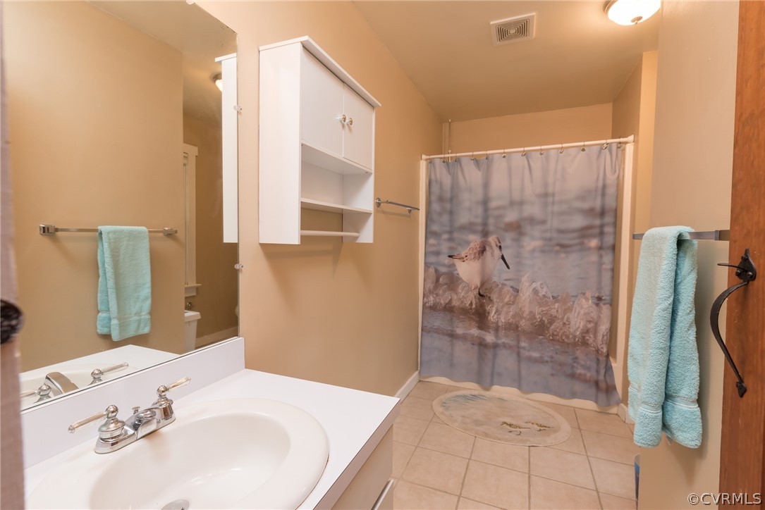 1400 Stone River Road North Chesterfield, VA 23235 - Photo 21 of 34 a bathroom with a sink and a mirror