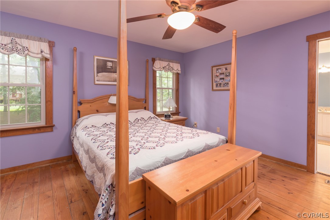 1400 Stone River Road North Chesterfield, VA 23235 - Photo 22 of 34 a bedroom with a bed and a chandelier