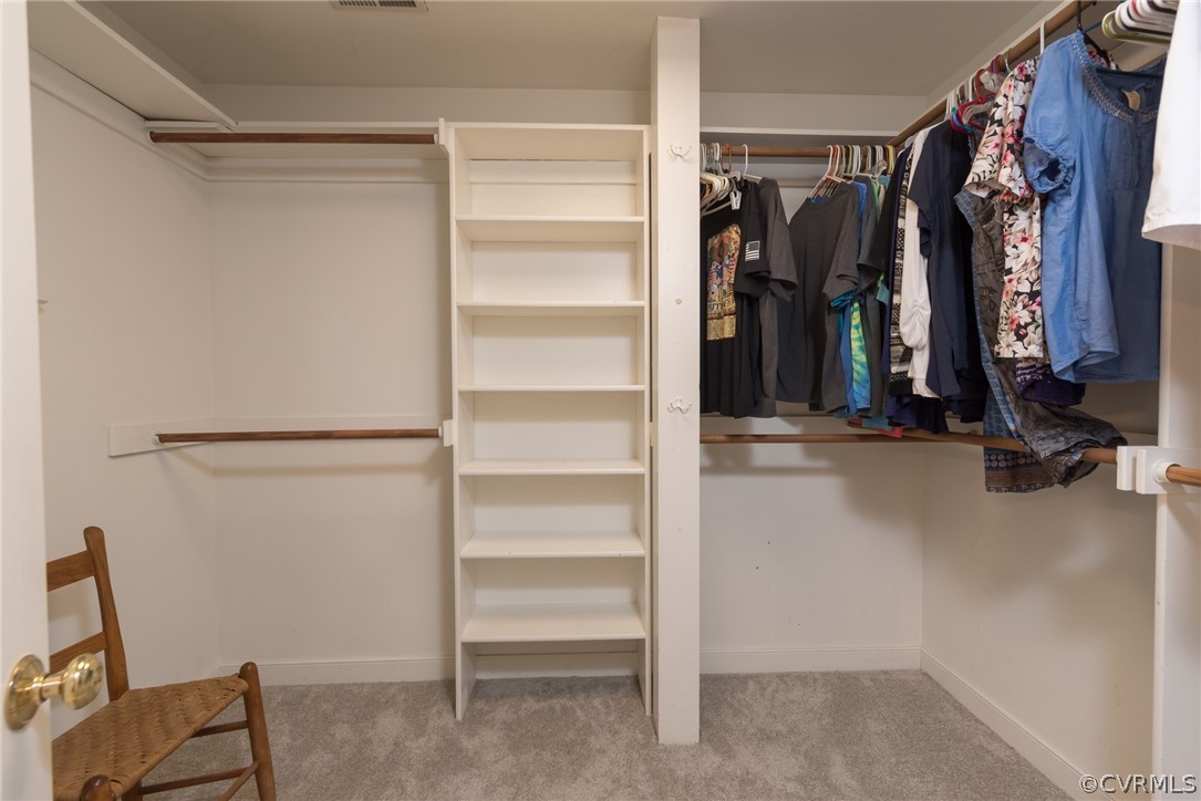 1400 Stone River Road North Chesterfield, VA 23235 - Photo 24 of 34 a view of walk in closet with clothes and shoes