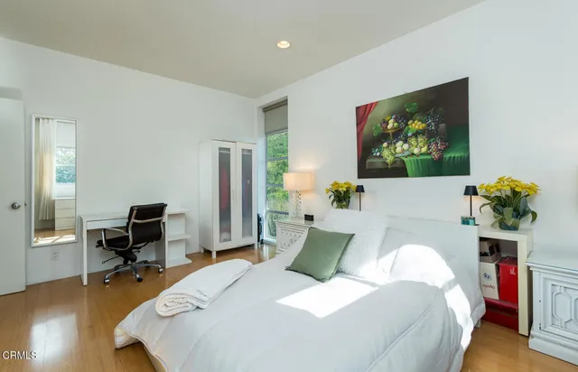 a bedroom with a bed and furniture