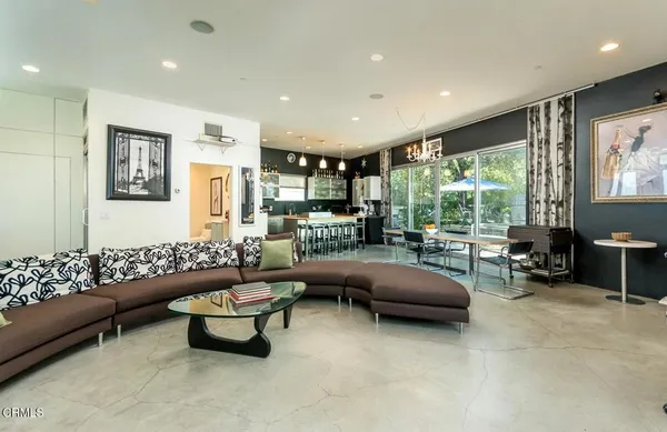 a bedroom with a bed and flat screen tv
