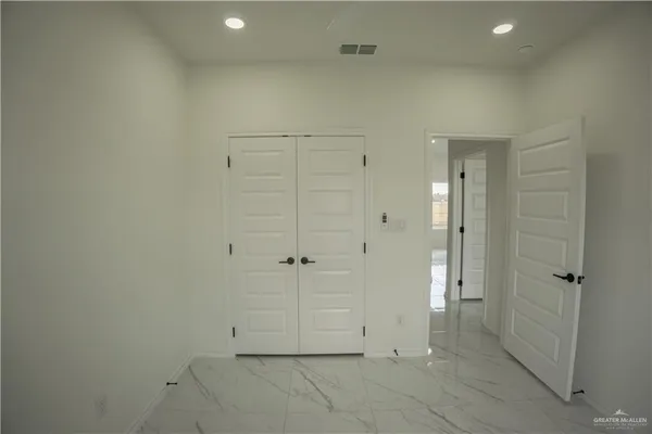 a bathroom with a glass shower door
