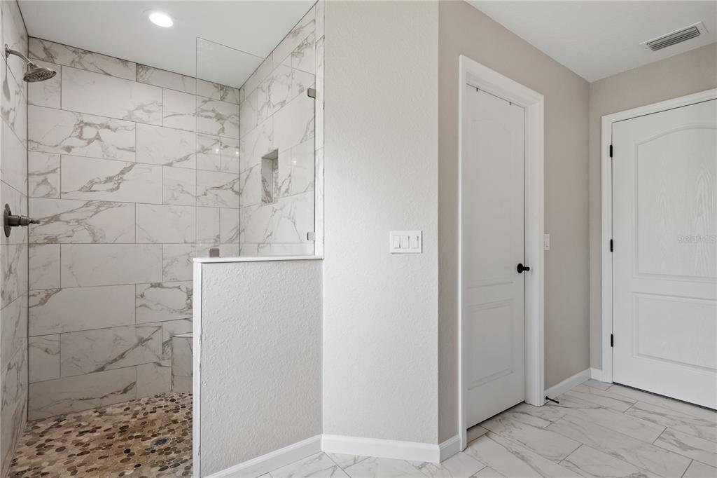 12929 Southwest 89th Street Dunnellon, FL 34432 - Photo 23 of 76 a bathroom with a shower