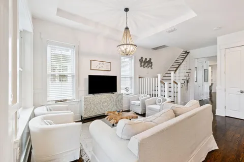a kitchen with stainless steel appliances granite countertop a sink stove and wooden floor