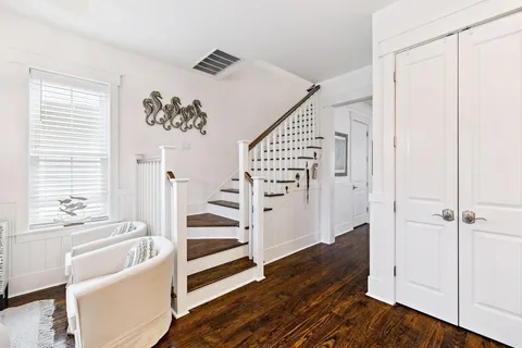 a en suite bathroom with a granite countertop tub shower and mirror