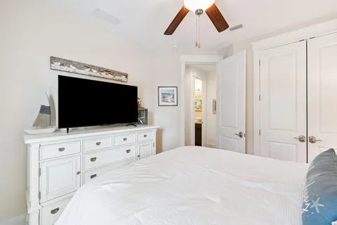 a bathroom with a granite countertop sink toilet a mirror and shower