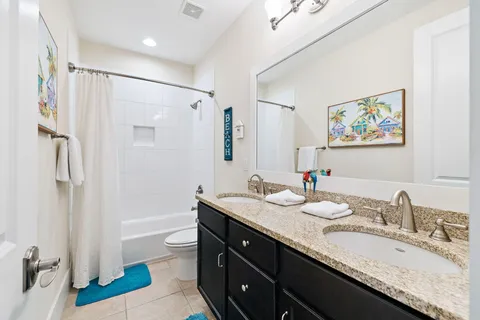 a front view of a house with a yard garage and outdoor seating