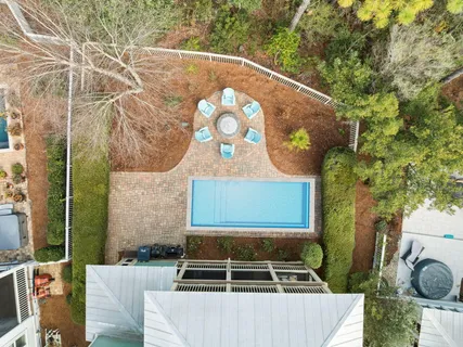 a balcony with furniture and a large window