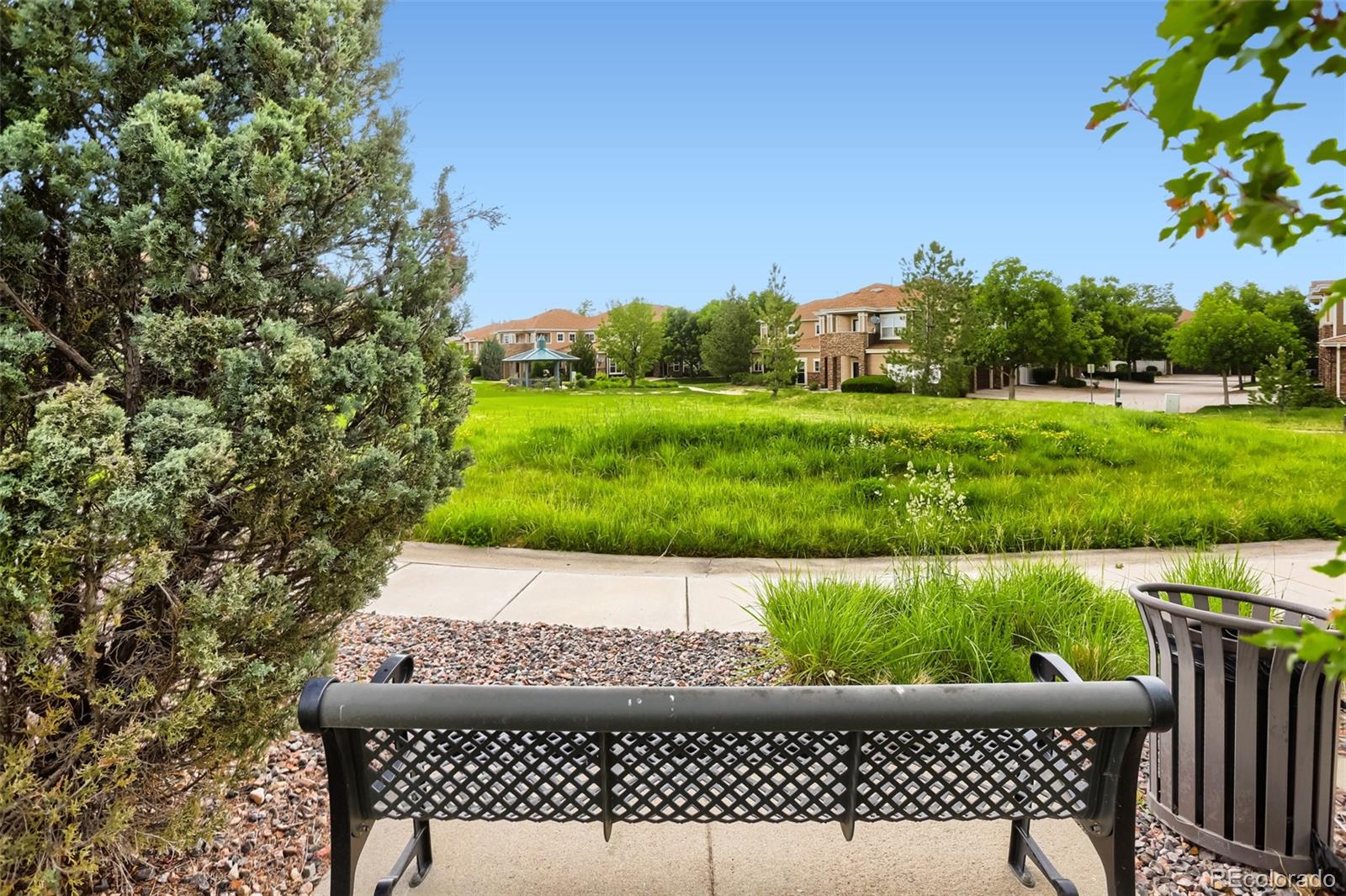 6232 Kilmer Loop, Unit 203 Golden, CO 80403 - Photo 28 of 33 a view of a yard with plants and outdoor seating